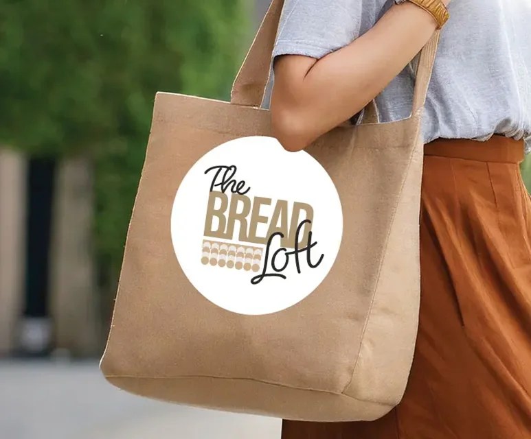 Mockup of "The bread loft" logo on a tote bag